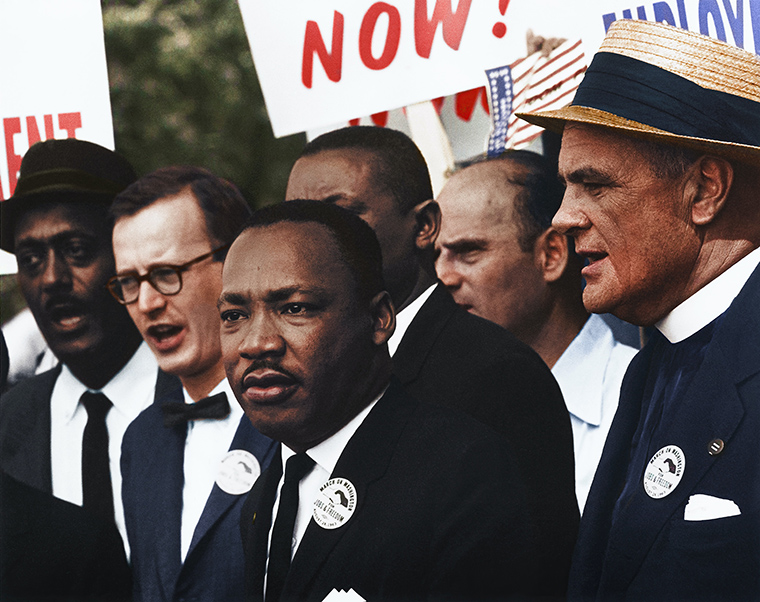 MLK with supporters at left and right