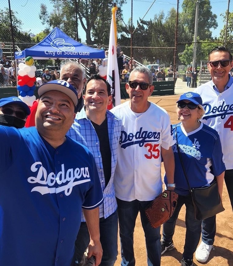 Group photo of Speaker Rendon with constituents wearing Dodgers jerseys