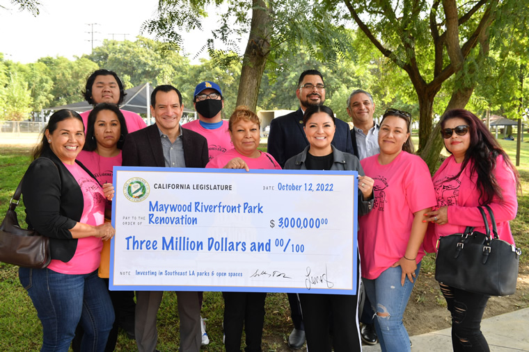 Group photo with large check held at center