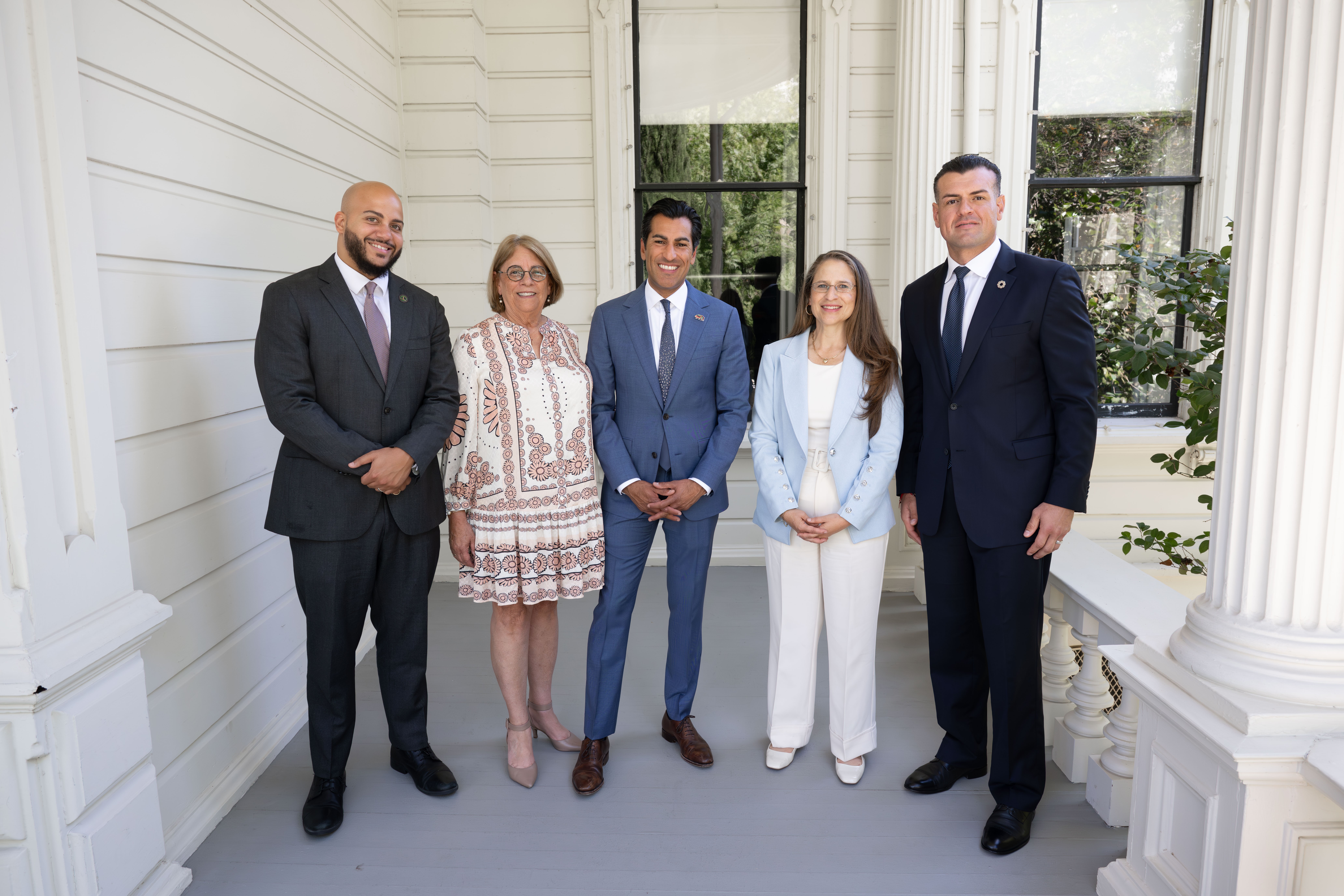 Speaker Robert Rivas standing alongside Assemblymembers