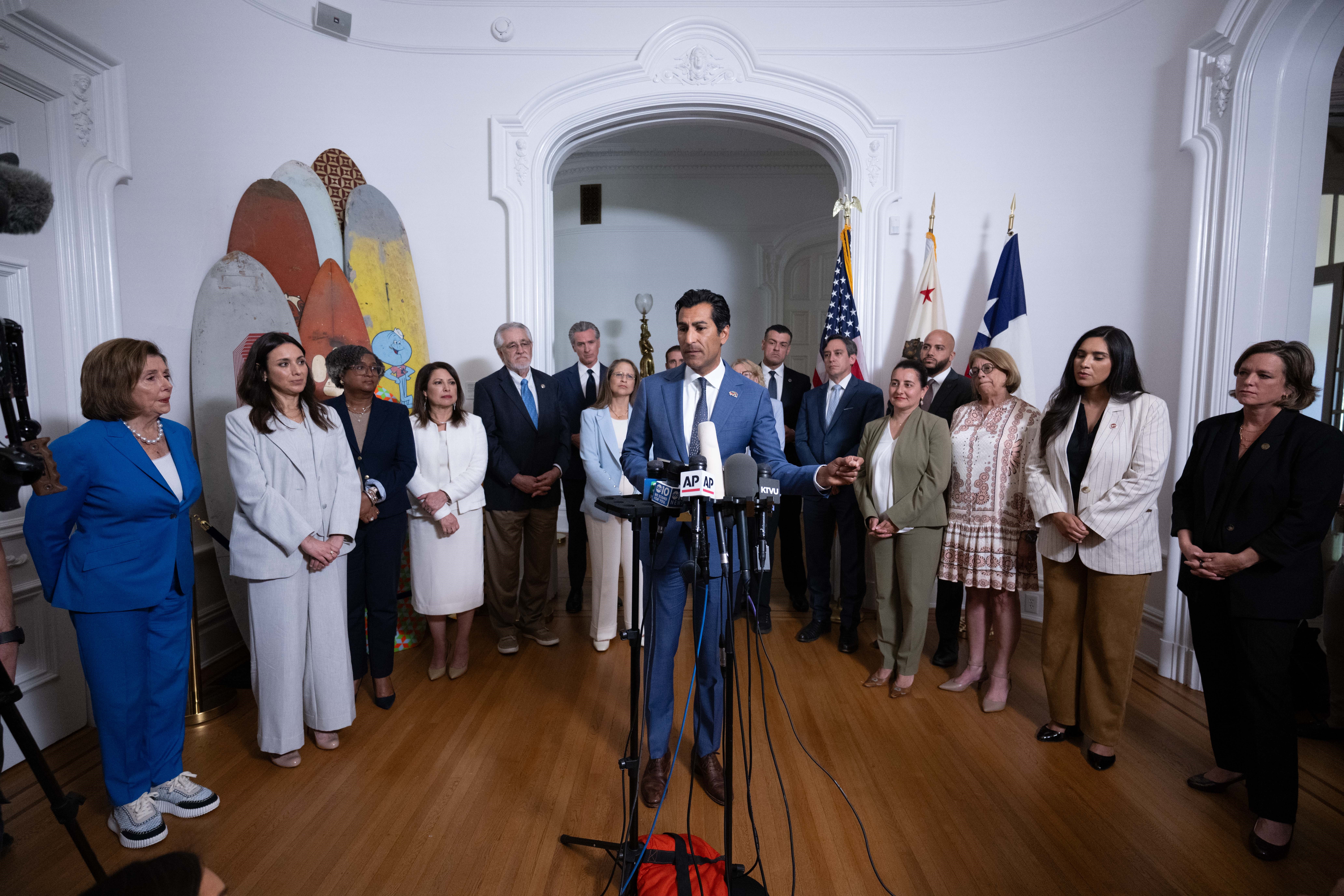 Speaker Robert Rivas standing at podium