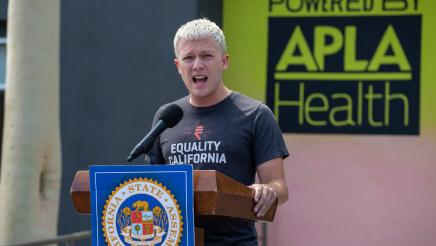 Samuel Garrett-Pate from Equality California, at podium speaking