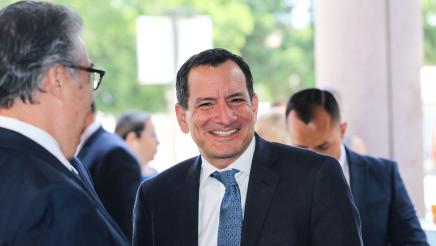 Speaker Rendon sharing a light moment with attendee