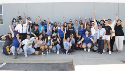 Assemblymember Rendon and event partners pose for a group picture at his backpack giveaway 