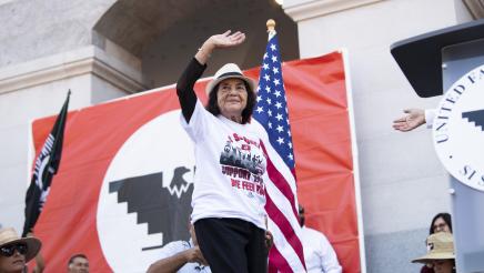 Civil rights and labor activist Dolores Huerta waves to supporters.