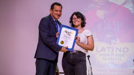 Speaker Rendon presenting award to honoree