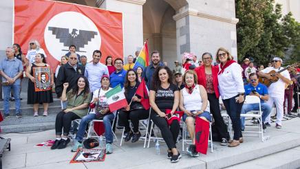 Assemblymember Robert Rivas stands with fellow legislators and advocates at a UFW rally.