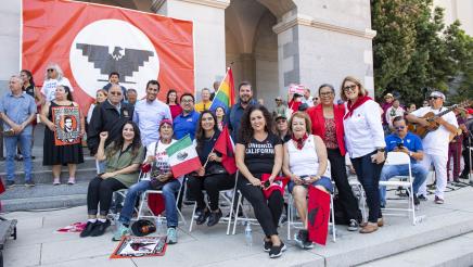 Assemblymember Robert Rivas stands with fellow legislators and advocates at a UFW rally.