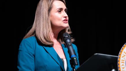 Claudia Botero at podium, speaking