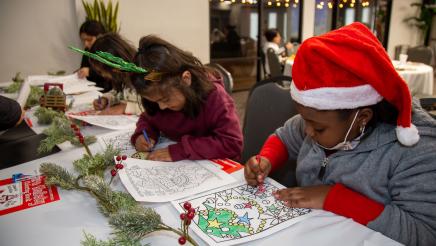 Kids coloring at table