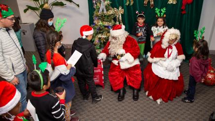 Kids in line for photos with Mr. and Mrs. Claus
