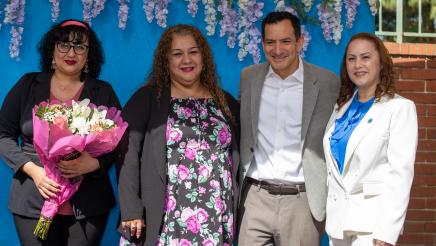 Speaker Rendon posing with Maria Mendoza and guest speakers