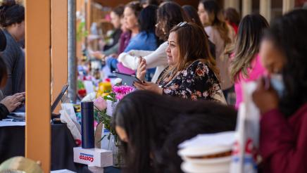 Attendees shopping in outdoor area