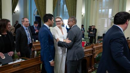 Speaker Rivas talks with Assemblymembers Buffy Wicks and Reggie Jones-Sawyer