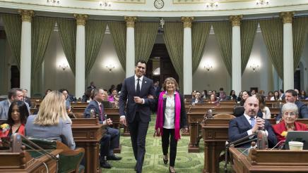 Assemblymember Robert Rivas Walks with Woman of the Year Evelia Morales Rosso