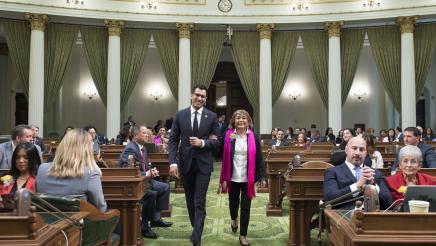 Assemblymember Robert Rivas Walks with Woman of the Year Evelia Morales Rosso
